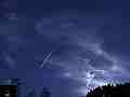 Comet-style jet trail passes below cirrus � digitally upscaled timelapse scene from Stitching the Sky Cat.#V00215x, 1280x720 Motion JPEG (.AVI), 3 sec. at 30fps 