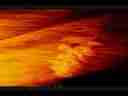 Catalog#:V01728 License:$56.00, Format:720x480 Motion JPEG(.AVI) at 30fps, Length: approx.9 sec. Orange-red backlit stratus wave, extreme zoom timelapse