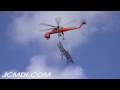 Sikorsky S-64 Skycrane carrying 500Kv Tower top to site Cat.#V04850, 1920x1080 H.264 AVCHD (.MTS), 21 sec. at 30fps 