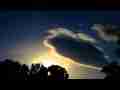 Catalog#:V07403 License:$216.00, Format:1920x1080 Motion JPEG(.AVI) at 30fps, Length: approx.49 sec. Irridescent 'UFO' lenticular cloud morphing sunset timelapse