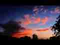 Colorful strato-cumulus and jet trail timelpase sunrise Cat.#V07621, 1920x1080 Motion JPEG (.AVI), 12 sec. at 30fps 