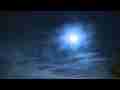 Colorful zoomed cirrus passing in front of moon night sky timelapse Cat.#V10411, 1920x1080 Motion JPEG(.AVI), 16 sec. at 30fps 