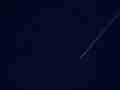 Faint jet trail streaking across deep blue sky timelapse Cat.#V10731, 1920x1080 Motion JPEG (.AVI), 2 sec. at 30fps 