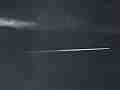 Jet leaves short trail in steel blue sky timelapse Cat.#V10734a, 1920x1080 Motion JPEG (.AVI), 5 sec. at 30fps 