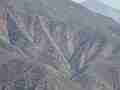 Fire helicopter (distant) flying through rugged terrain (Castaic Warm Fire) Cat.#V18942, 1920x1080 H.264/avc1(.MOV), 17 sec. at 29.971fps 