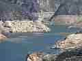 Fire helicopter approaches low lake level and sucks water (Castaic Warm Fire) Cat.#V18954, 1920x1080 H.264/avc1(.MOV), 51 sec. at 29.971fps 