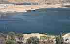 California extreme drought low water (Castaic Lake, pan left to dam) Cat.#V18964, 1920x1080 H.264/avc1(.MOV), 14 sec. at 29.971fps 