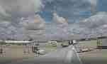 Parked at terminal (Atlanta Airport) with lots of ground traffic out window Cat.#V22963, 3840x2160 H.264/MPEG-4 AVC/avc1(.MP4), 21 sec. at 29.971fps 
